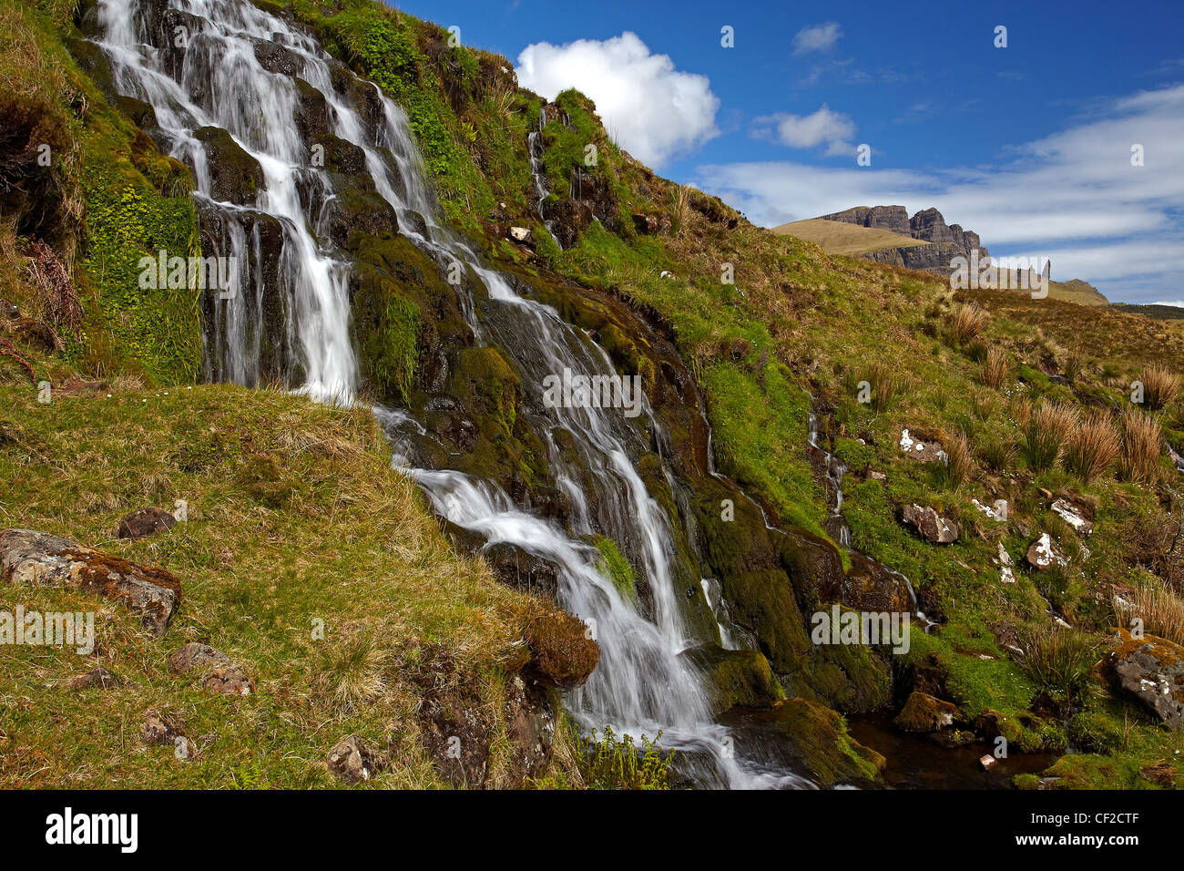 The Bride's Veil waterfall with the Old Man of Storr in the distance on