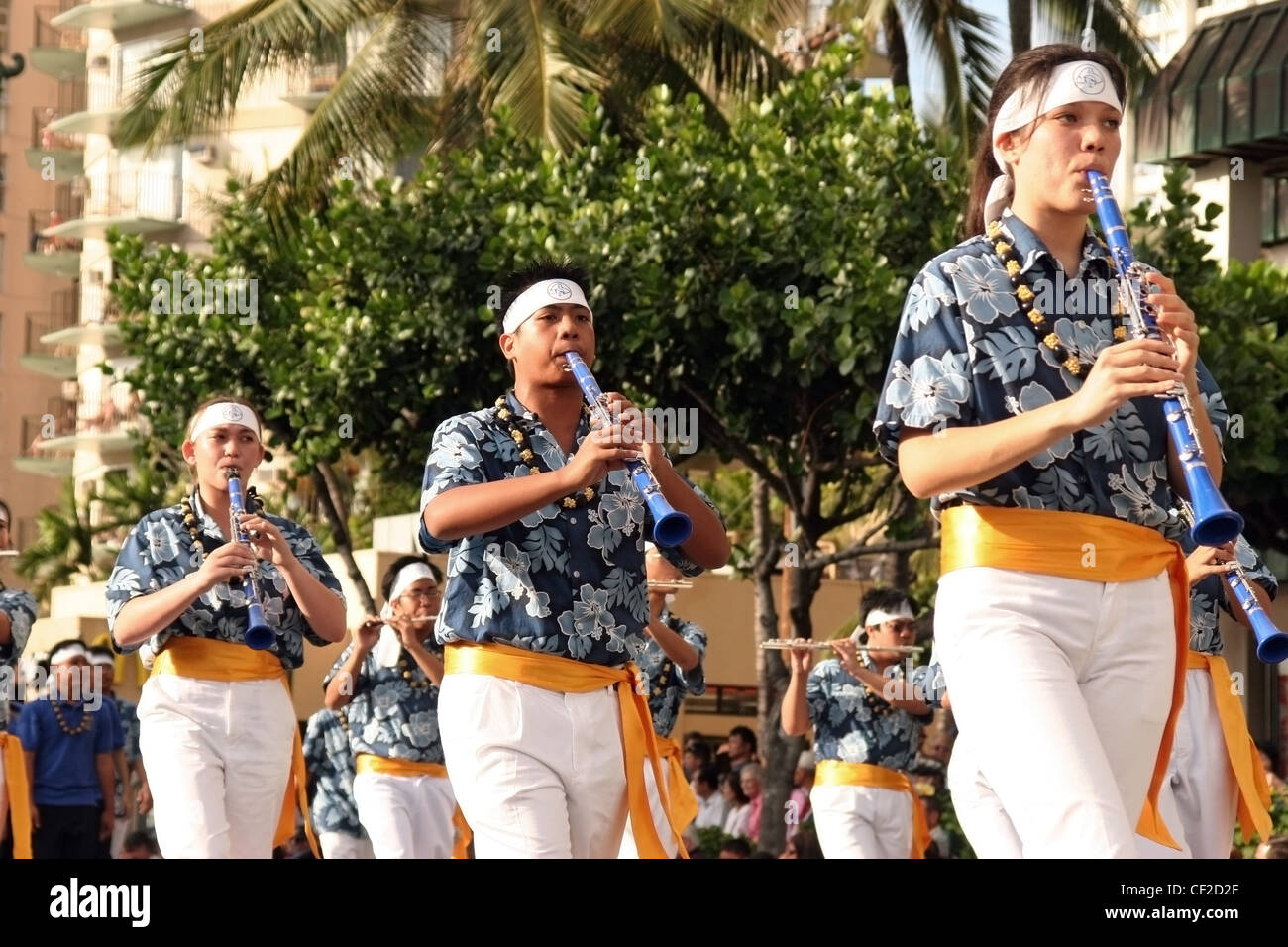 High school students are performing with in a marching band