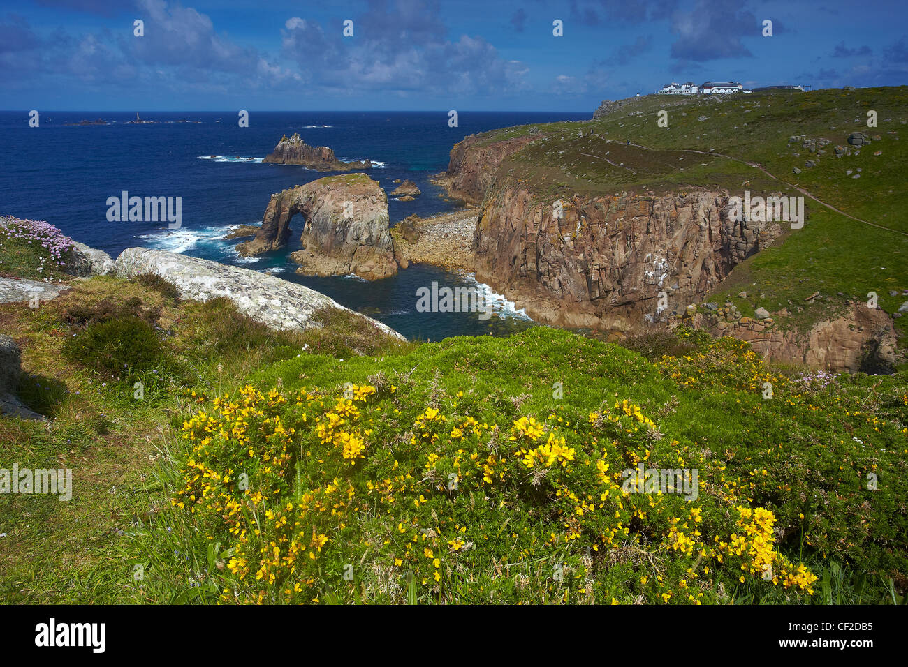 Land's End, the most westerly point of mainland England, looking towards the theme park and Longships Lighthouse. Stock Photo