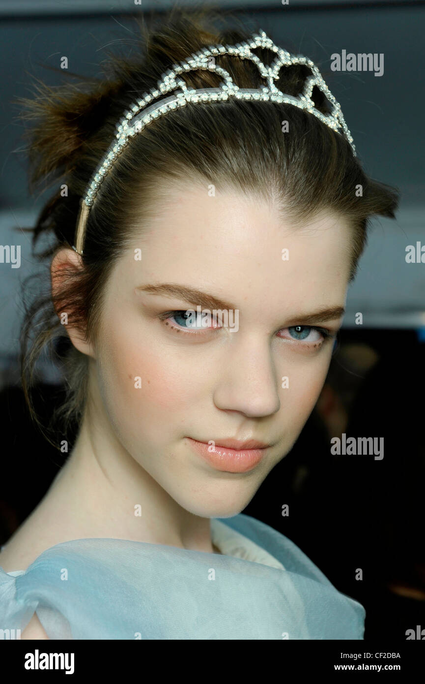 Louis Vuitton Backstage Paris Ready to Wear Autumn Winter Two models  wearing grey ruched jacket, skirt and dress, hair in a Stock Photo - Alamy