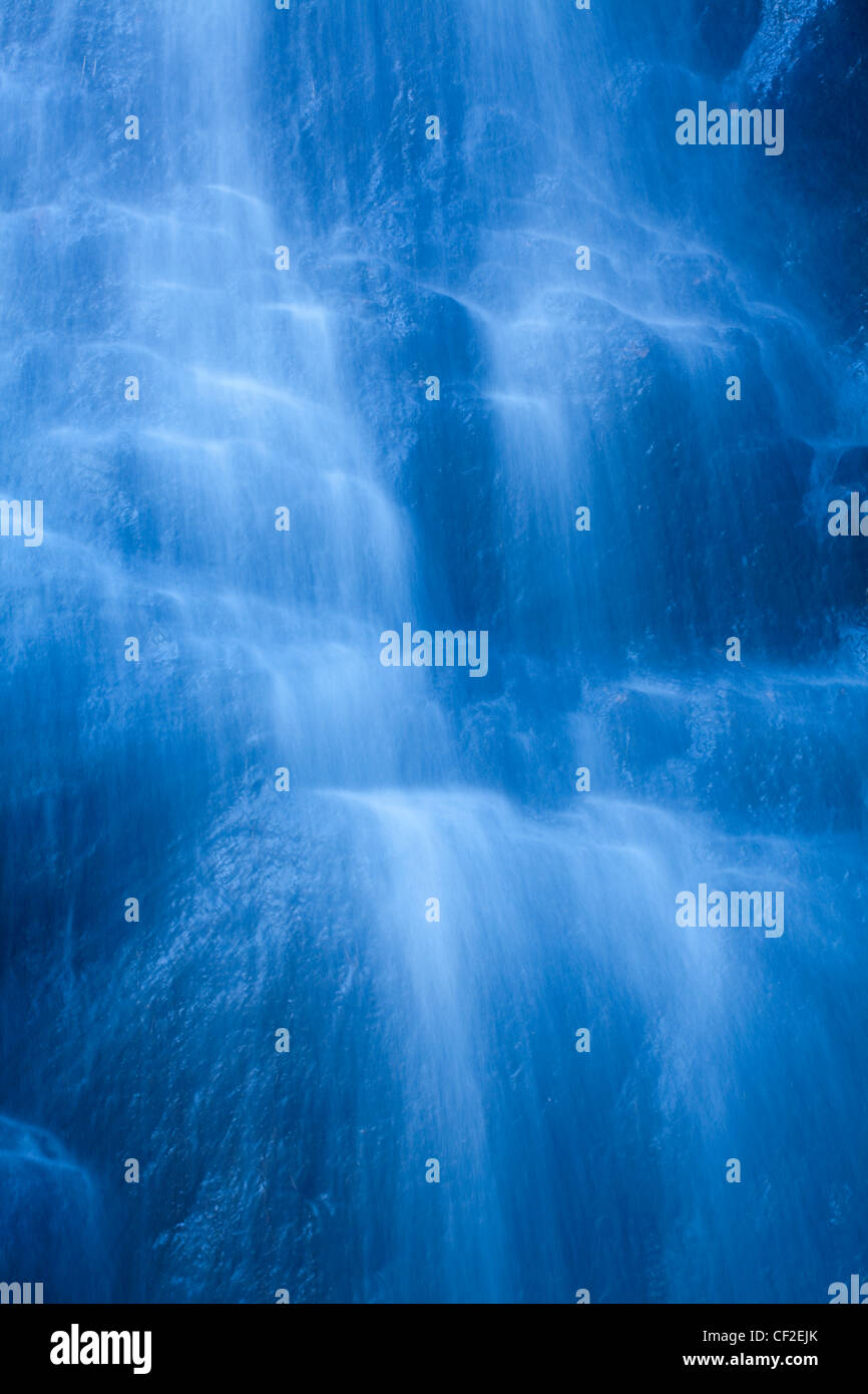 Close-up of cascading water in the Hareshaw Linn waterfall. Stock Photo