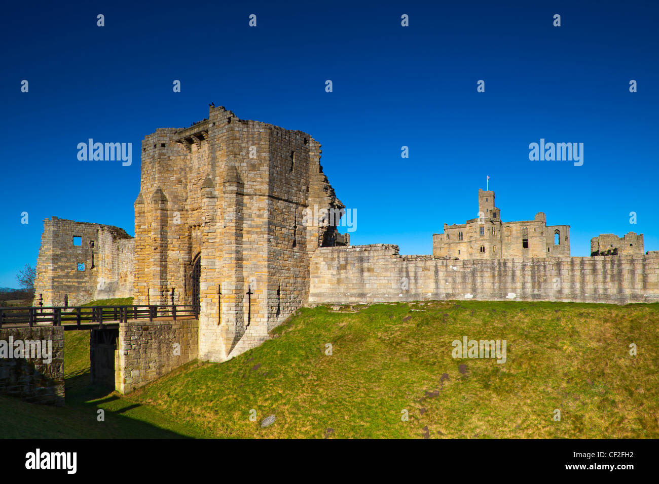 Warkworth Castle, a 12th century stone motte and bailey fortress located on a defensive mound in the village of Warkworth. Stock Photo