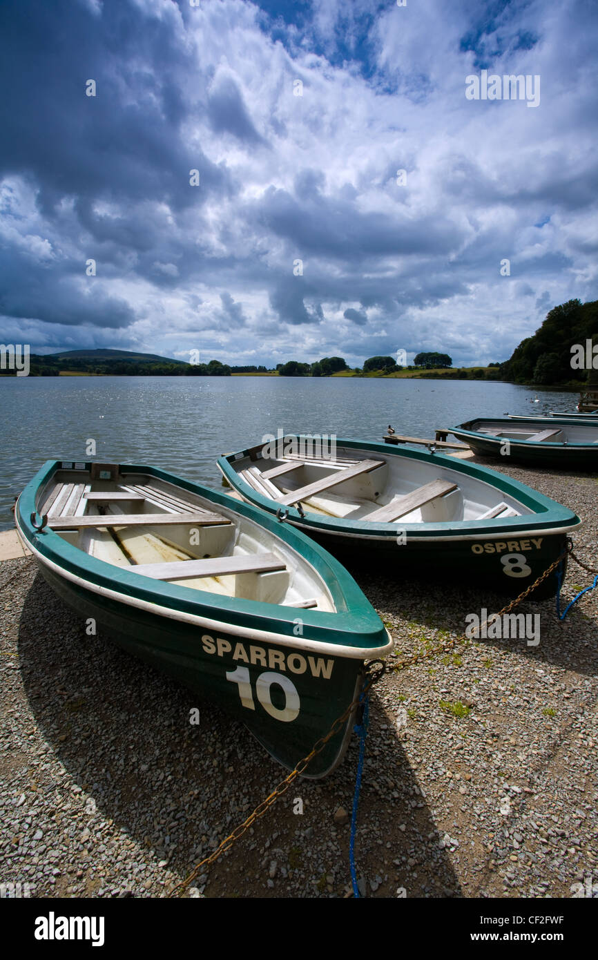 Rowing boats on the shore of the Talkin Tarn near Carlisle. Stock Photo