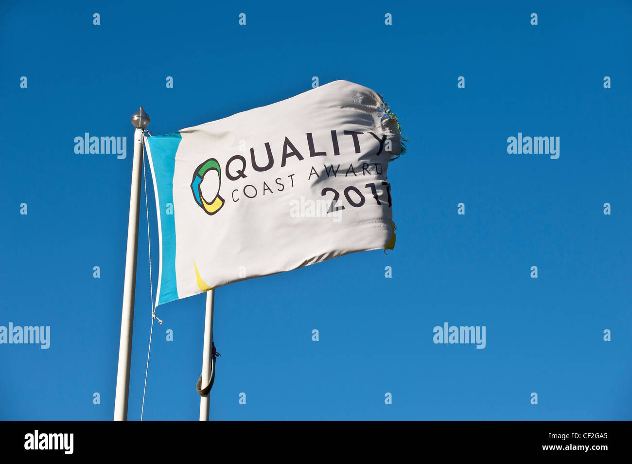 A Quality Coast Award flag in Southend on Sea symbolising that the beach is one of the best in Britain. Stock Photo