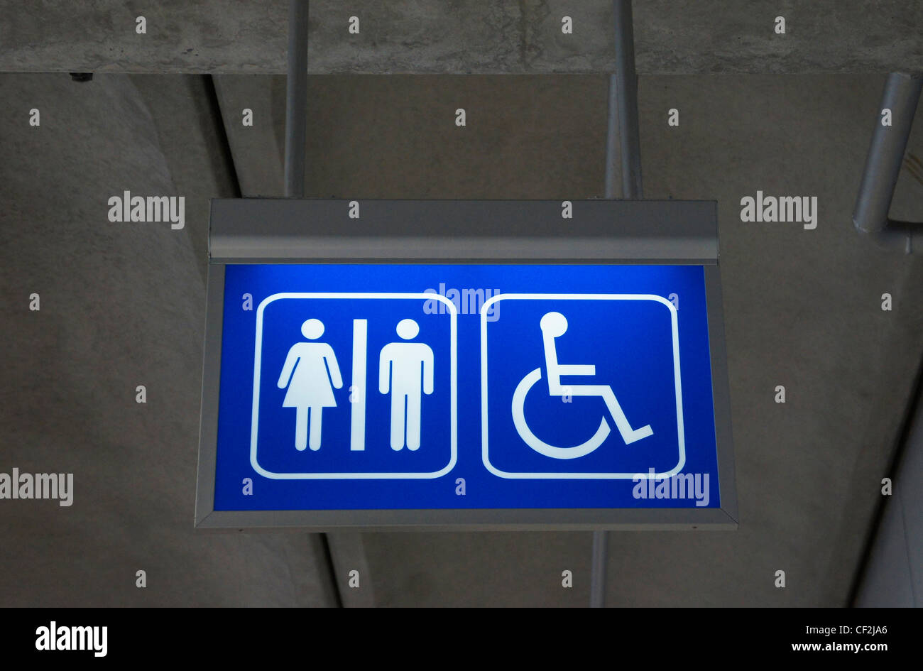Men and women toilet sign with an arrow showing direction Stock Photo ...