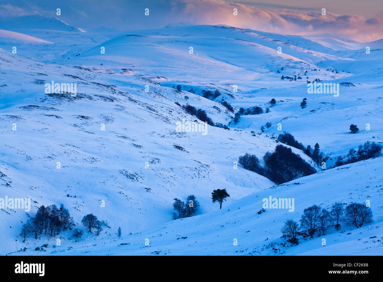 View from the the Old Military Road (now part of the A939) from near the Bridge of Brown looking across a snow covered valley to Stock Photo