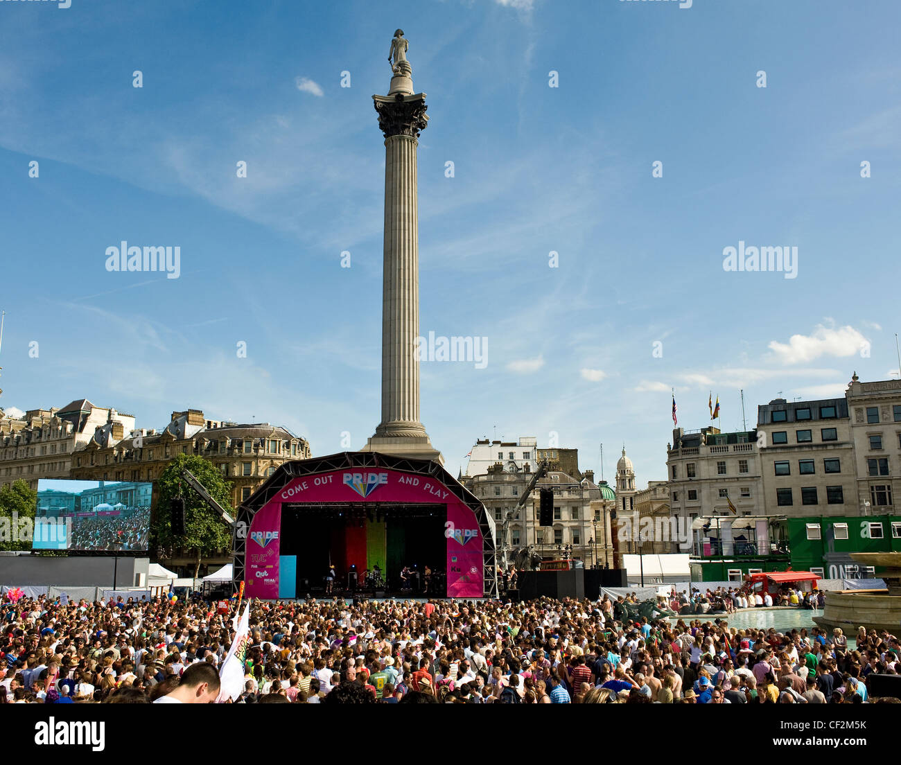 Large crowd of people enjoying a party atmosphere at a concert in Trafalgar Square as part of Pride London Parade. Stock Photo