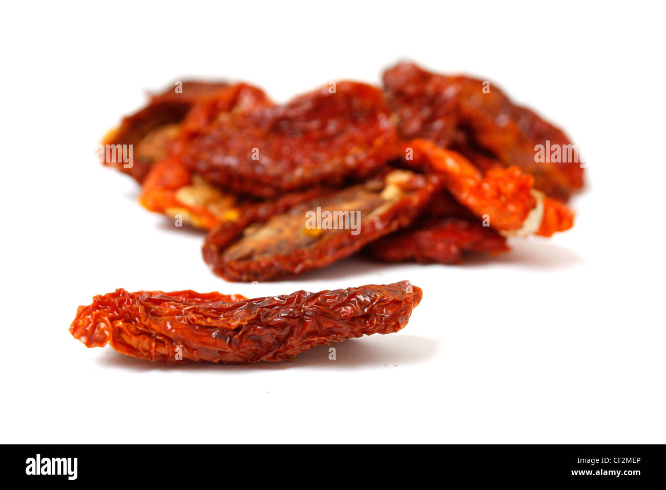 Dried tomatoes isolated on white Stock Photo