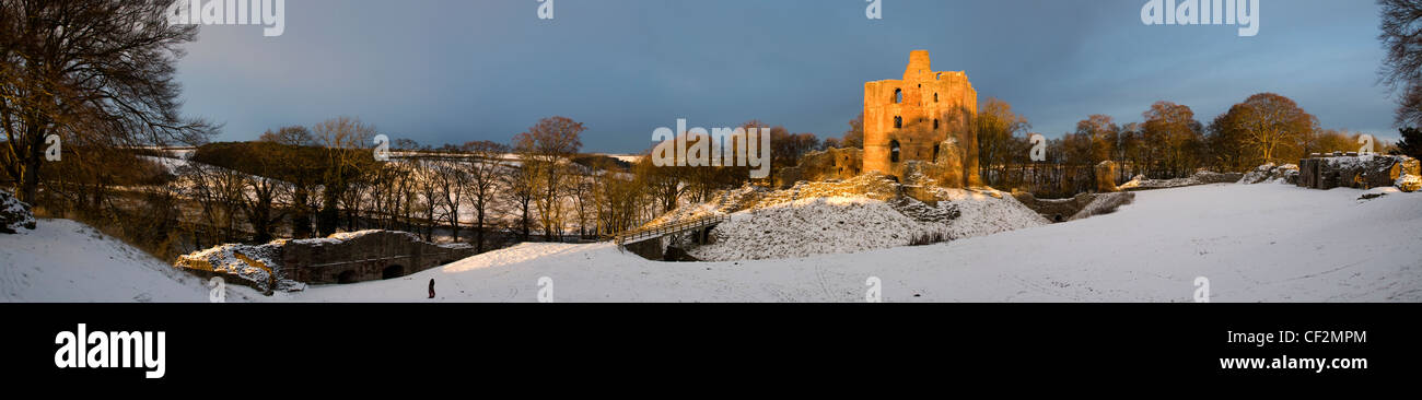 A winter landscape featuring Norham Castle, one of the most important of the Border castles, built in 1121 by the Bishops of Dur Stock Photo
