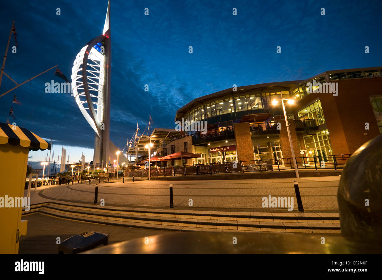 An early evening view of the 170m high Spinnaker Tower at Gunwharf Quays in Portsmouth Harbour. The tower offers breathtaking vi Stock Photo