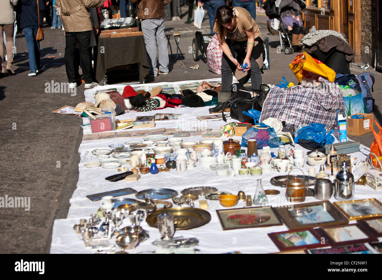 Flea market vendor of bric-a-brac, Brick Lane, London, England, UK Stock Photo