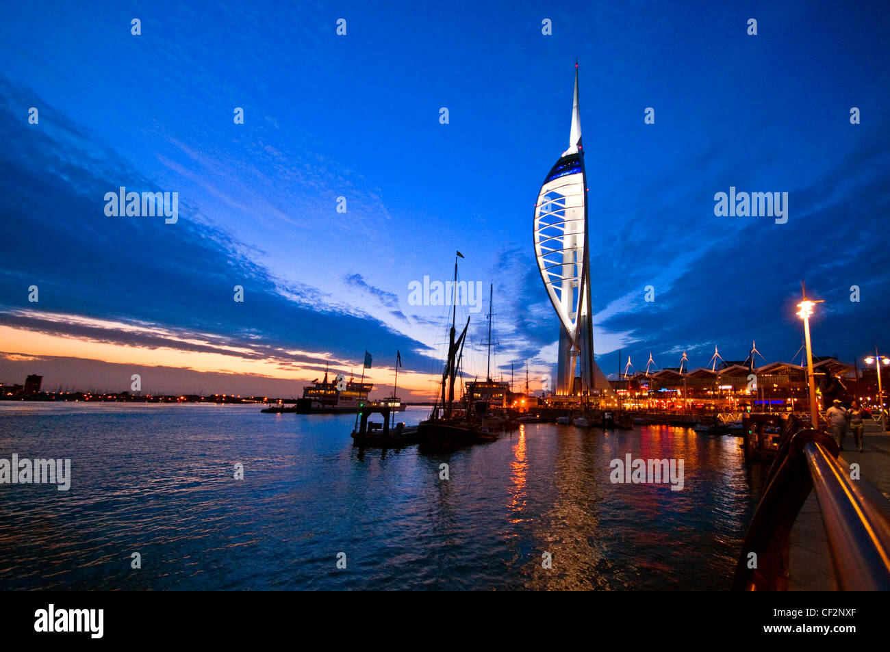 An early evening view of the 170m high Spinnaker Tower at Gunwharf Quays in Portsmouth Harbour. Stock Photo