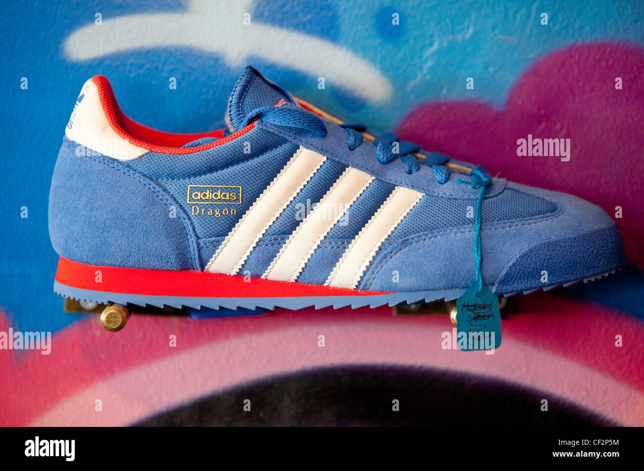 Adidas trainer in display for sale Stock Photo