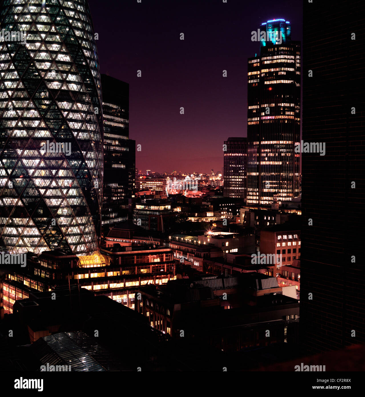 The Gherkin And Natwest Tower Buildings In London At Night Stock Photo