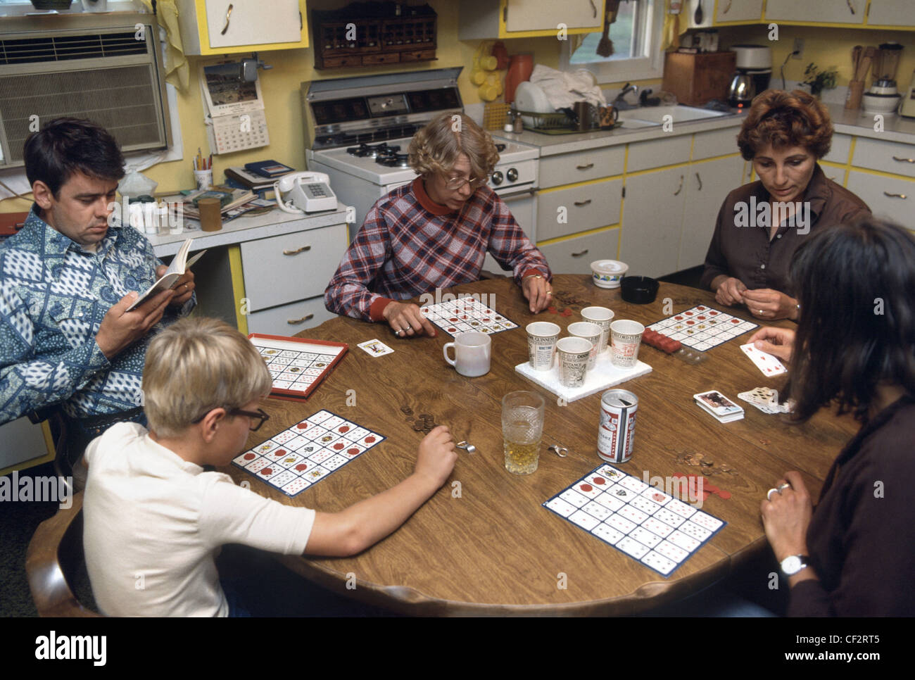 American Family Playing Board Game At The Kitchen Table Stock Photo Alamy