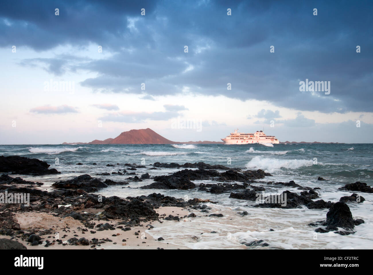canary island ferry passing the island of Los Lobos Stock Photo