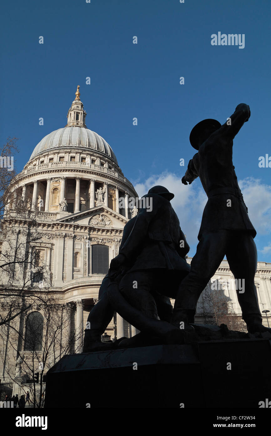 The National Firefighters Memorial with the Dome of St Pauls Cathedral behind, London. Stock Photo