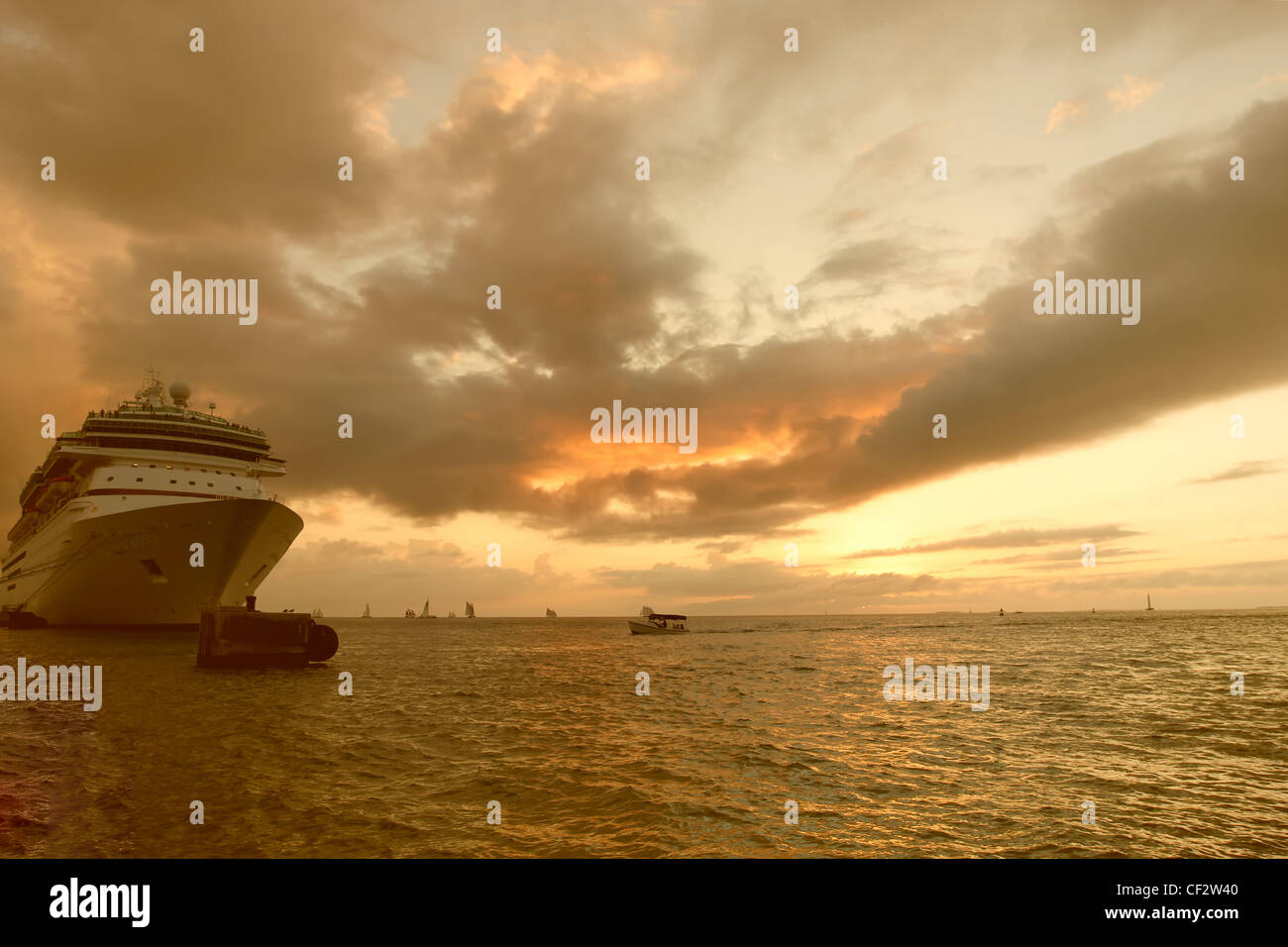 A cruise ship in port at sunset Stock Photo - Alamy