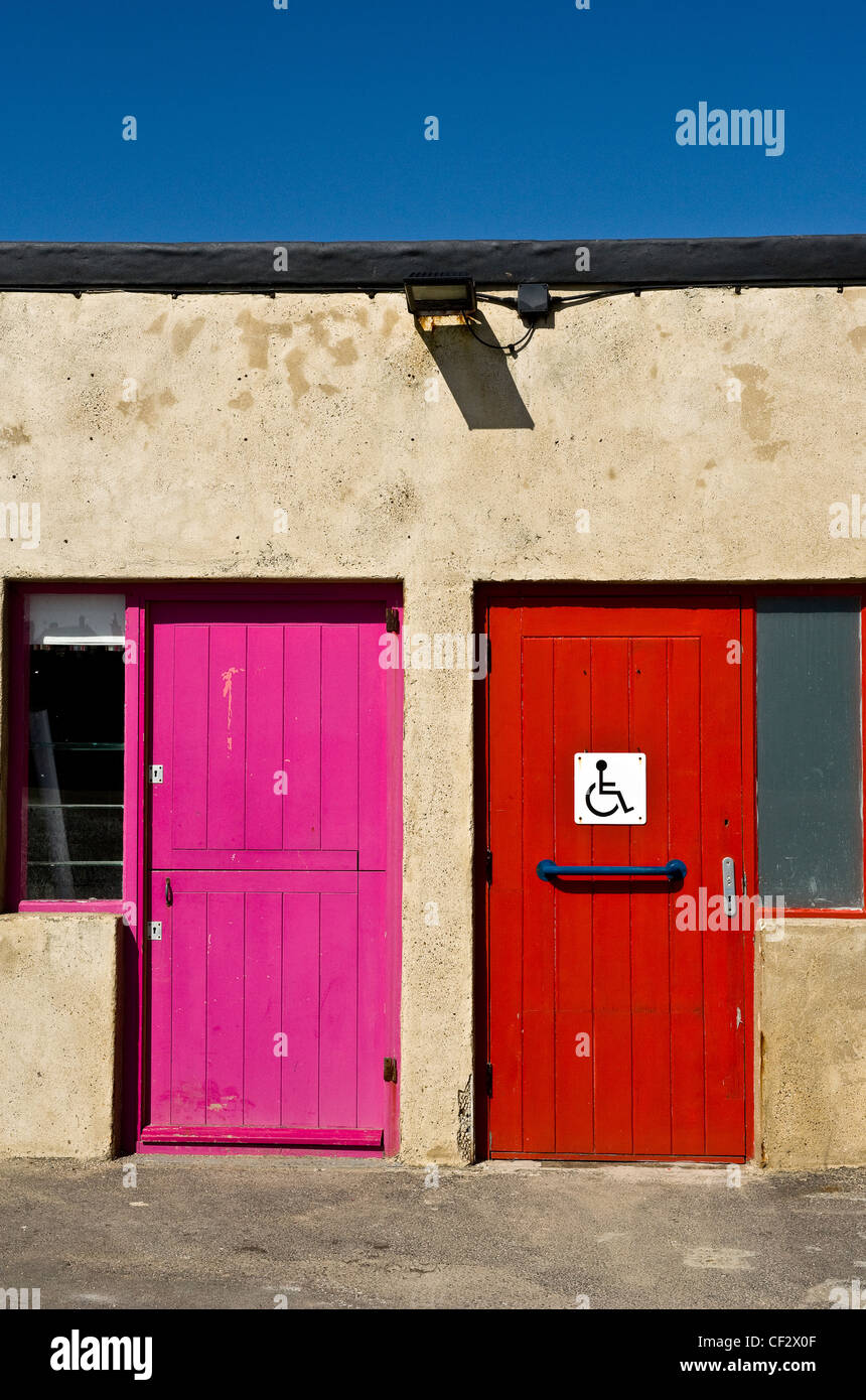 Two brightly painted doors on Margate Jetty. Stock Photo