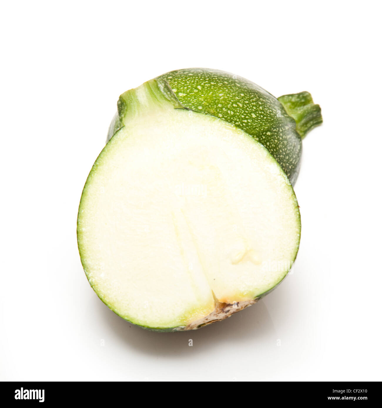 Globe courgette or zucchini isolated on a white studio background. Stock Photo