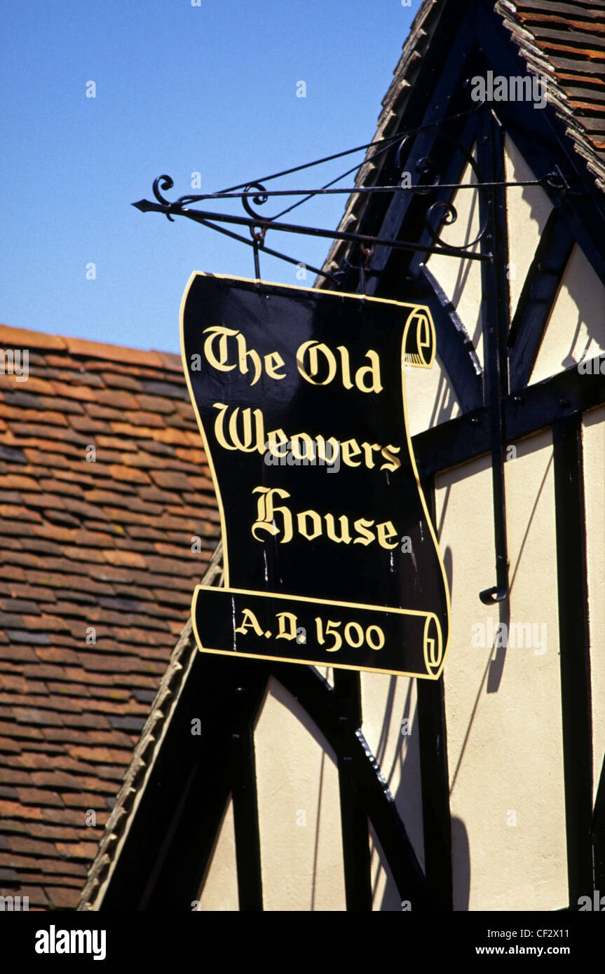 Black and gold hanging scroll sign of The Old Weavers House in Canterbury, England Stock Photo