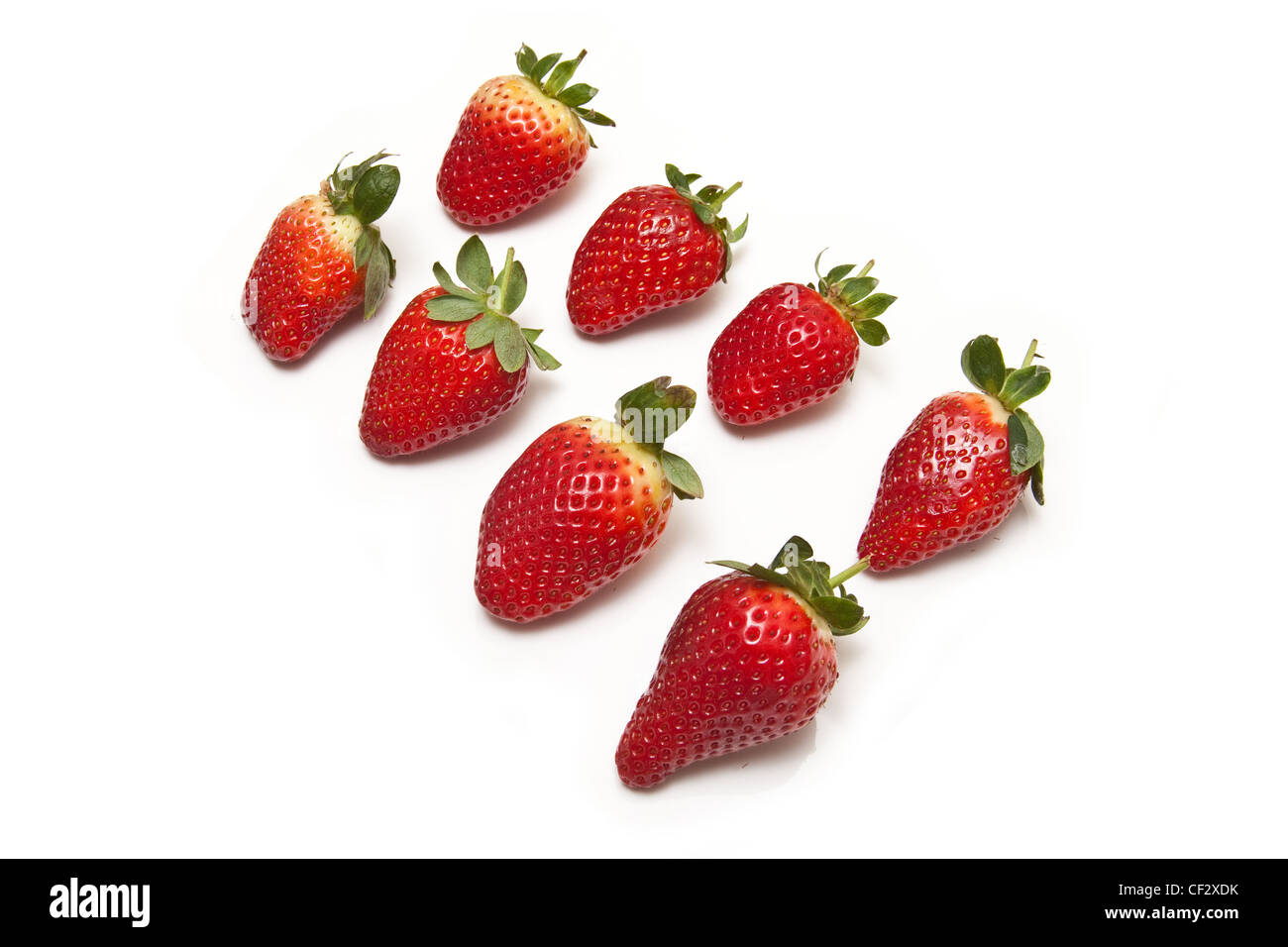 Strawberries isolated on a white studio background Stock Photo - Alamy