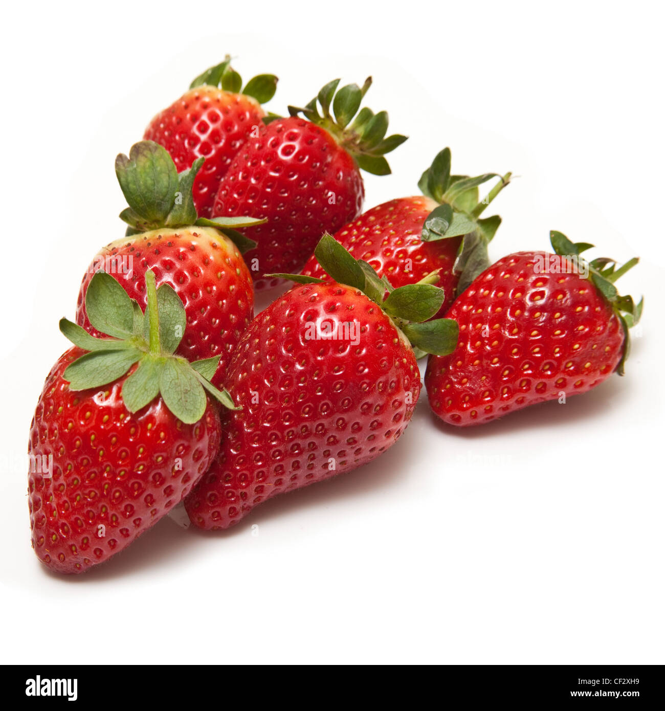 Strawberries isolated on a white studio background Stock Photo - Alamy