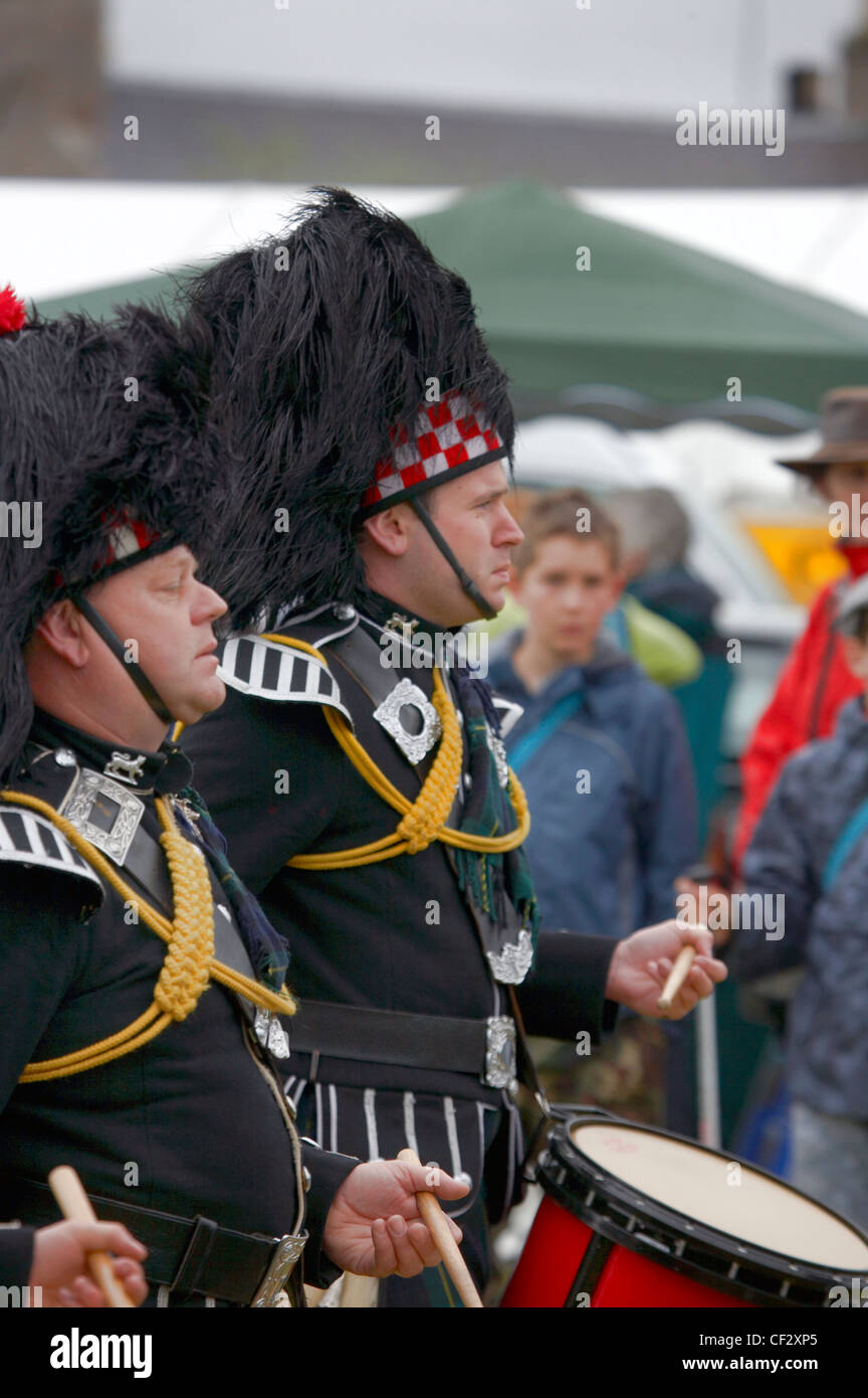 Drummers from The Ballater and District Pipe Band performing at the Lonach Gathering and Highland Games, (billed as ‚Äö√Ñ√≤Scotl Stock Photo