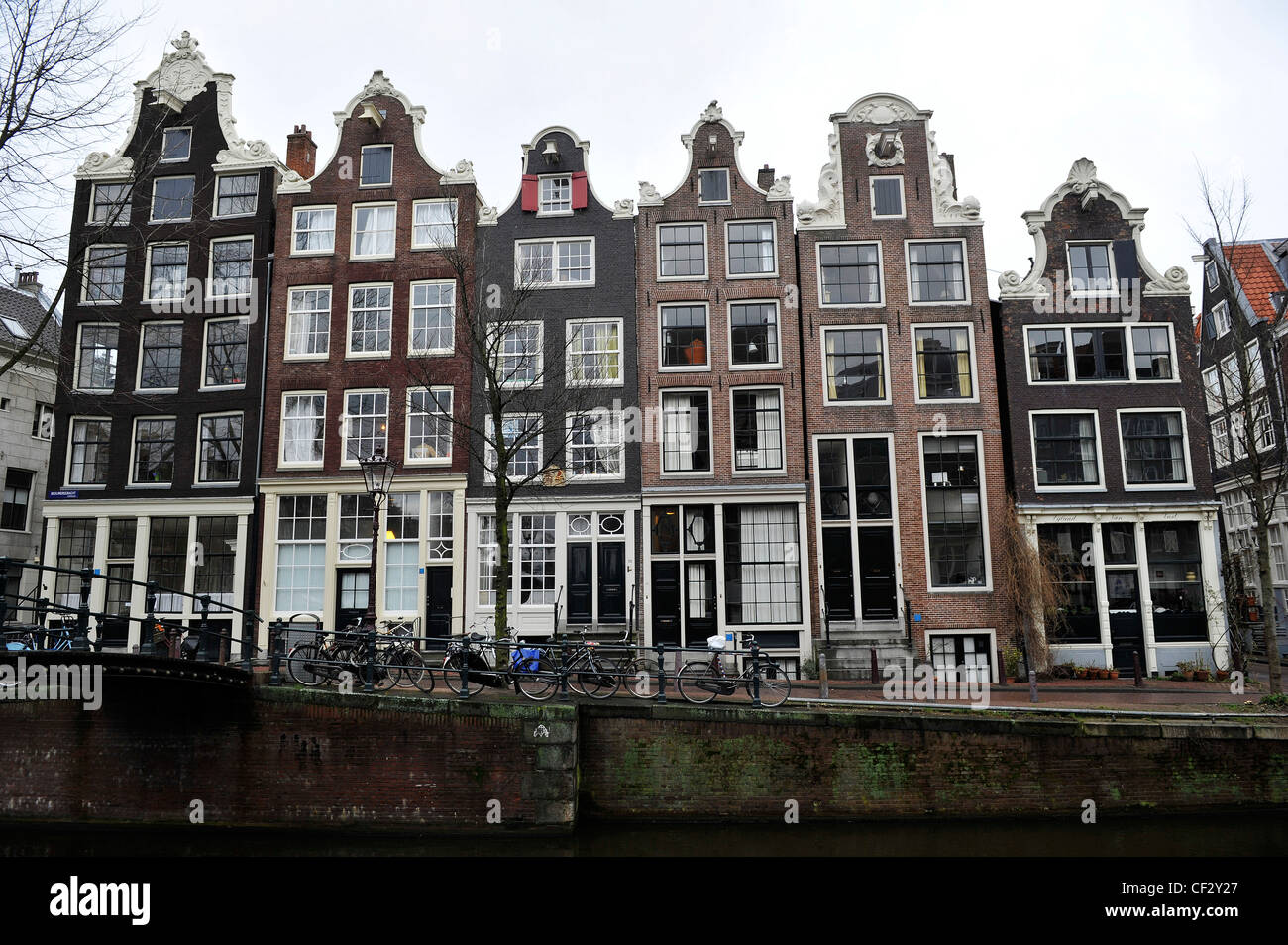 Typical Amsterdam buildings on the banks of a canal. Stock Photo