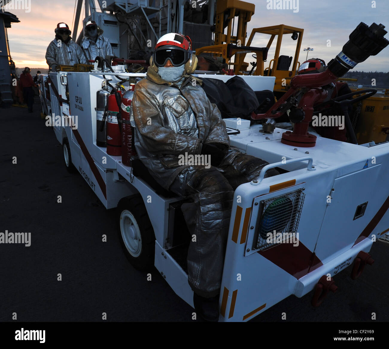 BREMERTON, Wash. (Feb. 28, 2012) – Sailors assigned to the aircraft carrier USS Nimitz’ (CVN 68) Crash & Salvage team man the P-25 Mobile Firefighting Unit during a simulated flight quarters. Nimitz is making final preparations to return to sea. Stock Photo