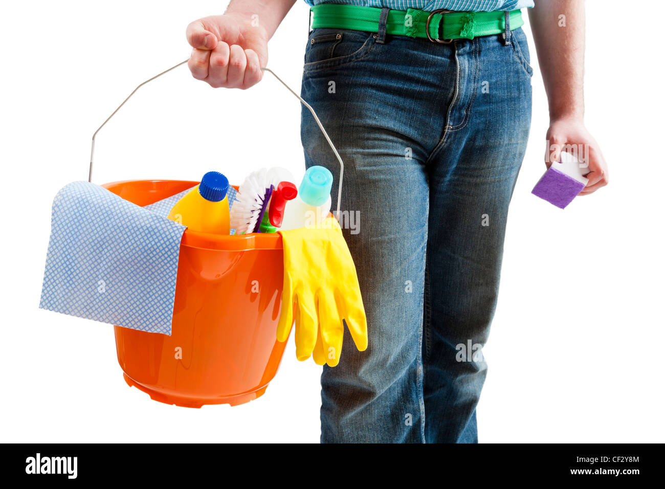 Spring cleaning concept. Young man carrying a bucket with cleaning products and materials and ready to clean up. Isolated on a white background. Stock Photo