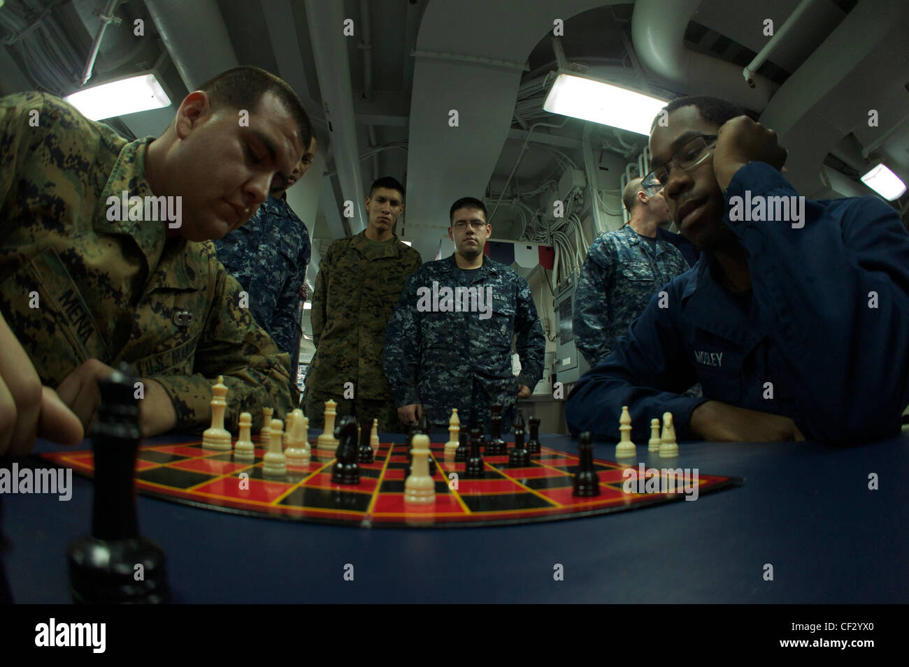 PACIFIC OCEAN (Feb. 28, 2012) Sailors and Marines participate in a chess tournament in the mess decks of the amphibious assault ship USS Bonhomme Richard (LHD 6). The ship is en route to relieve USS Essex (LHD 2) as the forward deployed ship in Sasebo, Japan Stock Photo