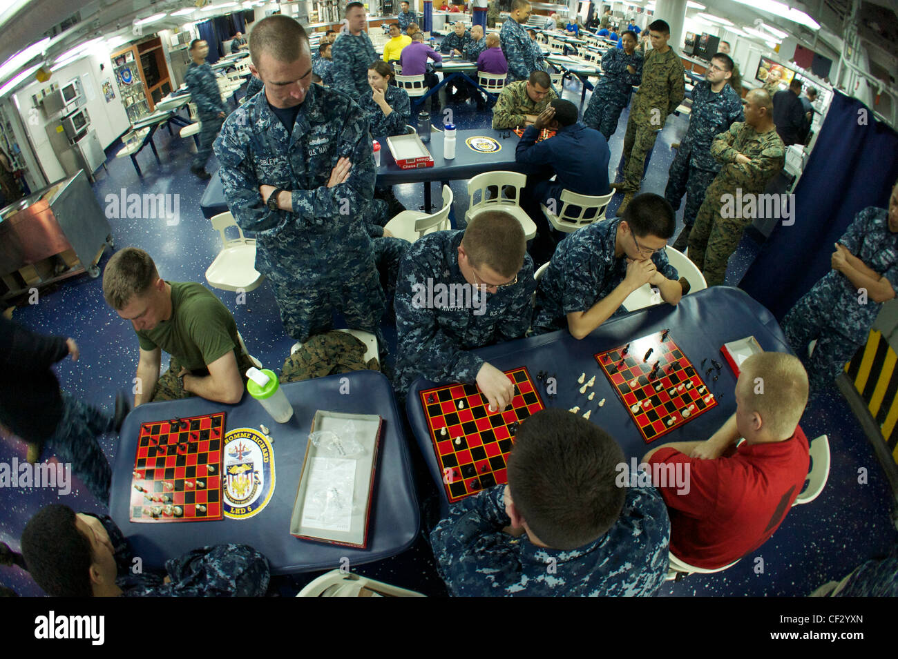 PACIFIC OCEAN (Feb. 28, 2012) Sailors and Marines participate in a chess tournament in the mess decks of the amphibious assault ship USS Bonhomme Richard (LHD 6). The ship is en route to relieve USS Essex (LHD 2) as the forward deployed ship in Sasebo, Japan Stock Photo