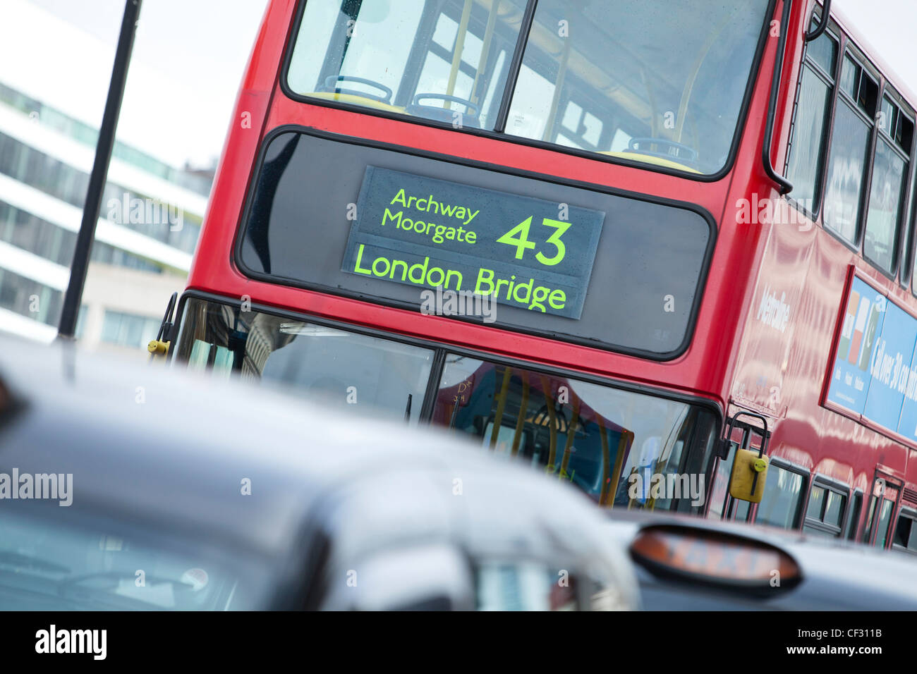 A view of London taxis and a red bus queuing on London Bridge Stock Photo