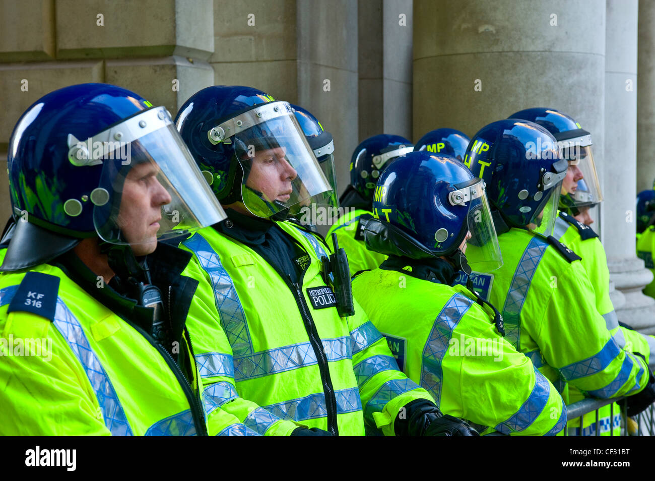 Metropolitan police officers in riot gear at a student demonstration in London. Stock Photo
