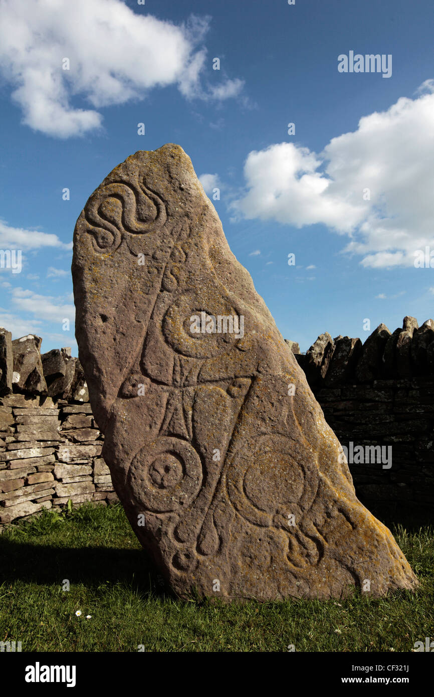 An Aberlemno sculptured stone featuring Pictish symbols of a serpent, a double disc and z-rod and a mirror and comb. Stock Photo