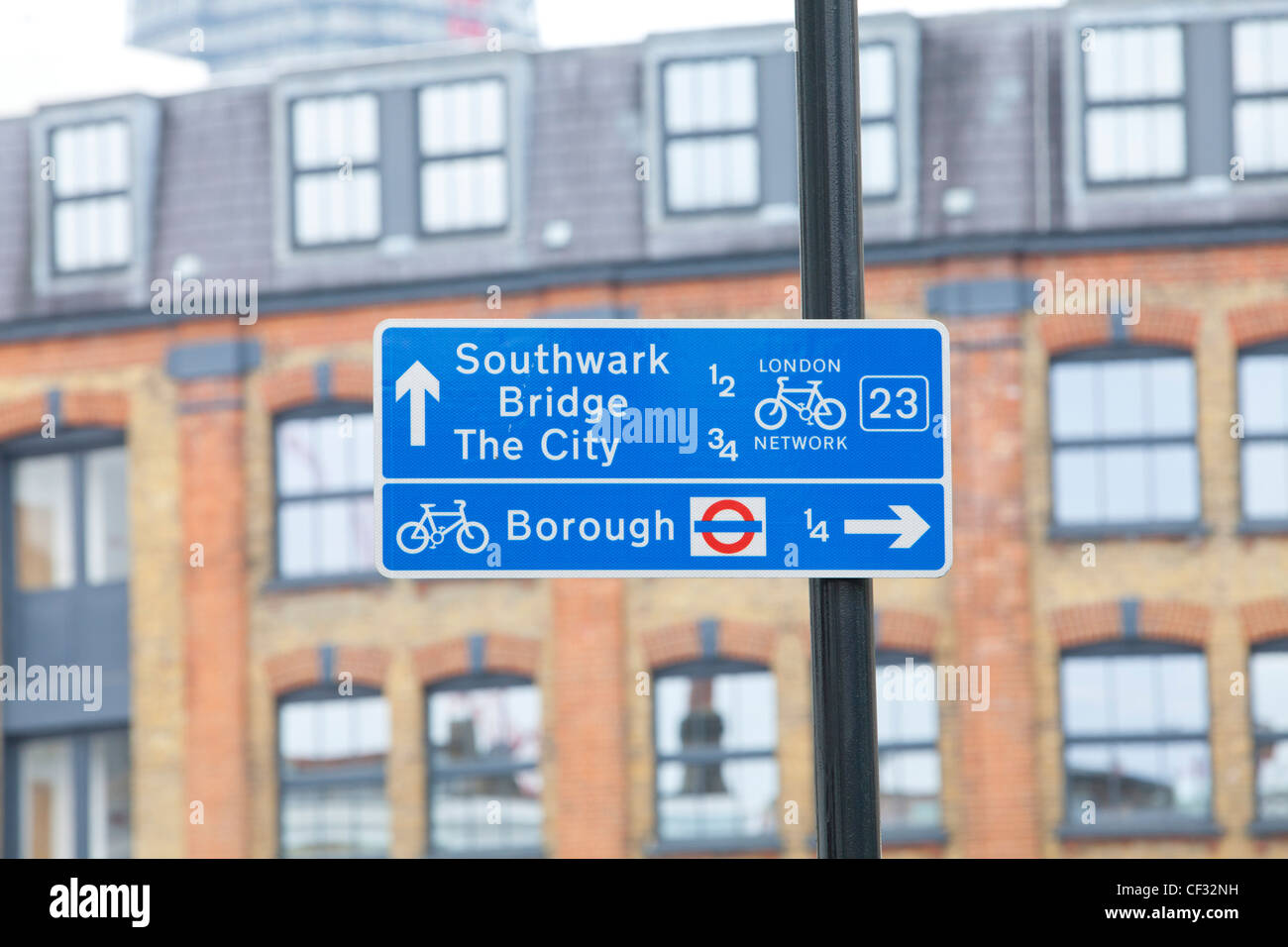 A view of a sign post giving directions to Southwark Bridge and the City and Borough underground station Stock Photo