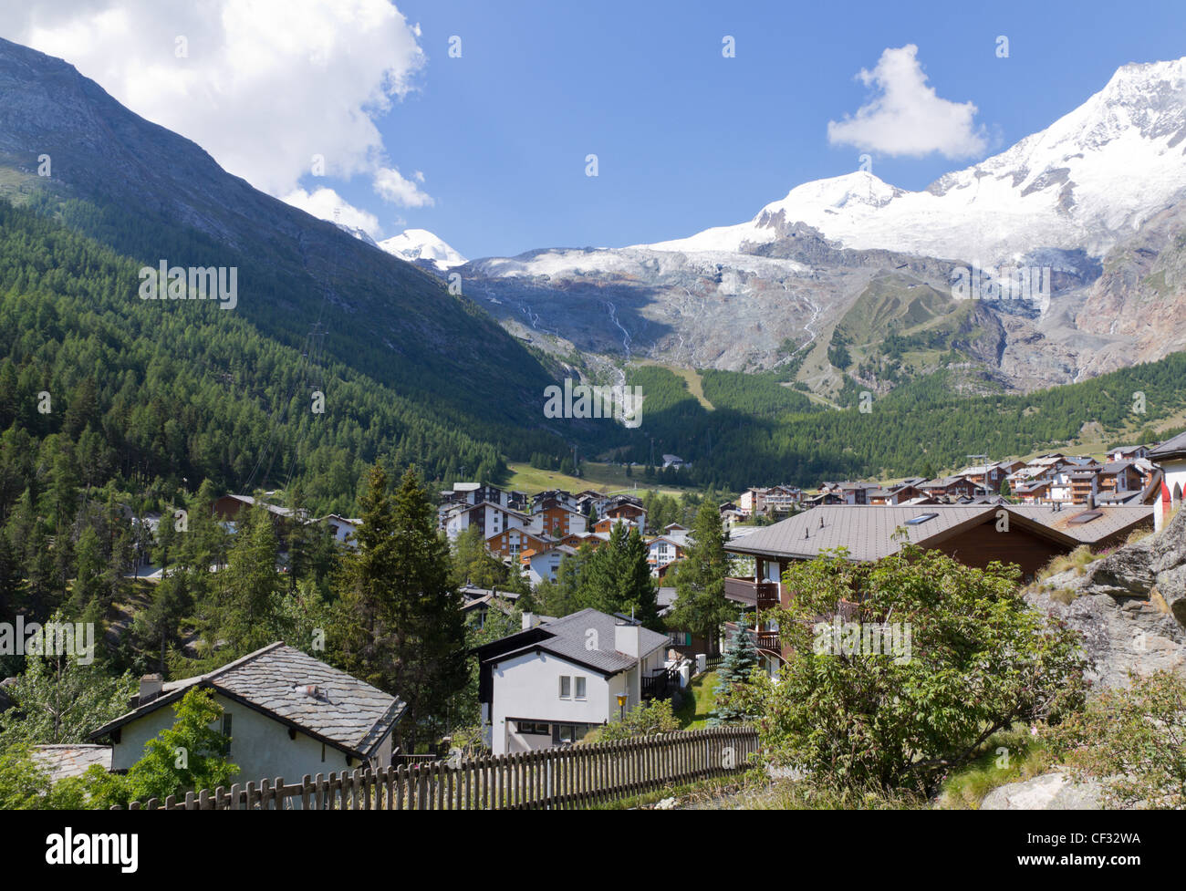 Alpine town of Saas Fee in Saas valley surrounded by high mountains, Vailais, Switzerland Stock Photo