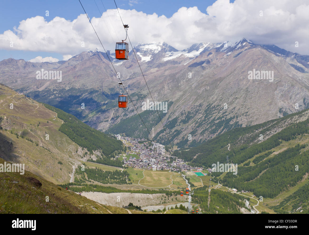Alpine town of Saas Fee in Saas valley surrounded by high mountains, connected by cable car, Valais, Switzerland Stock Photo