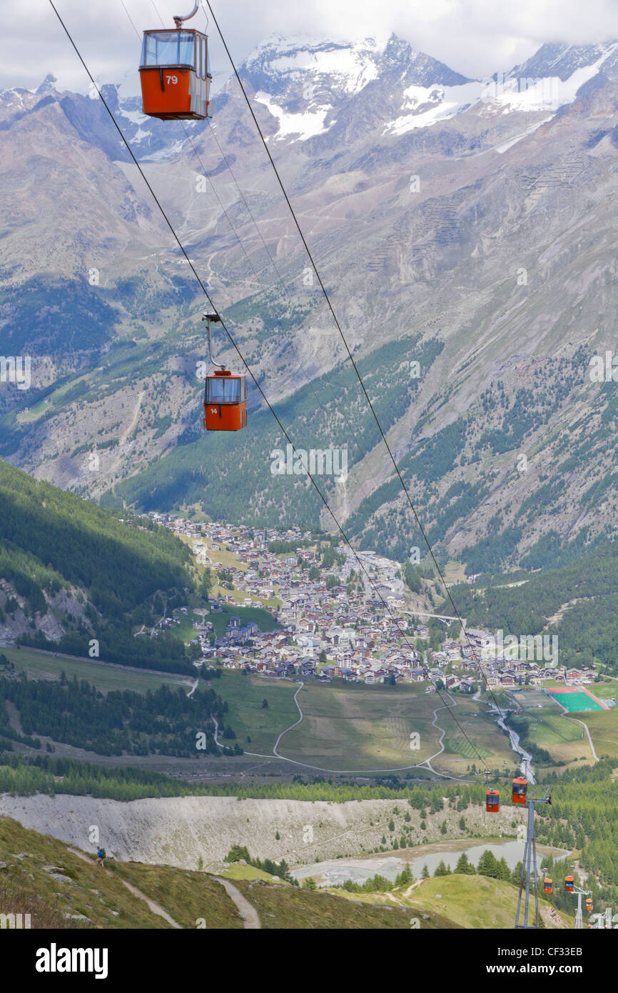 Alpine town of Saas Fee in Saas valley surrounded by high mountains, connected by cable car, Valais, Switzerland Stock Photo
