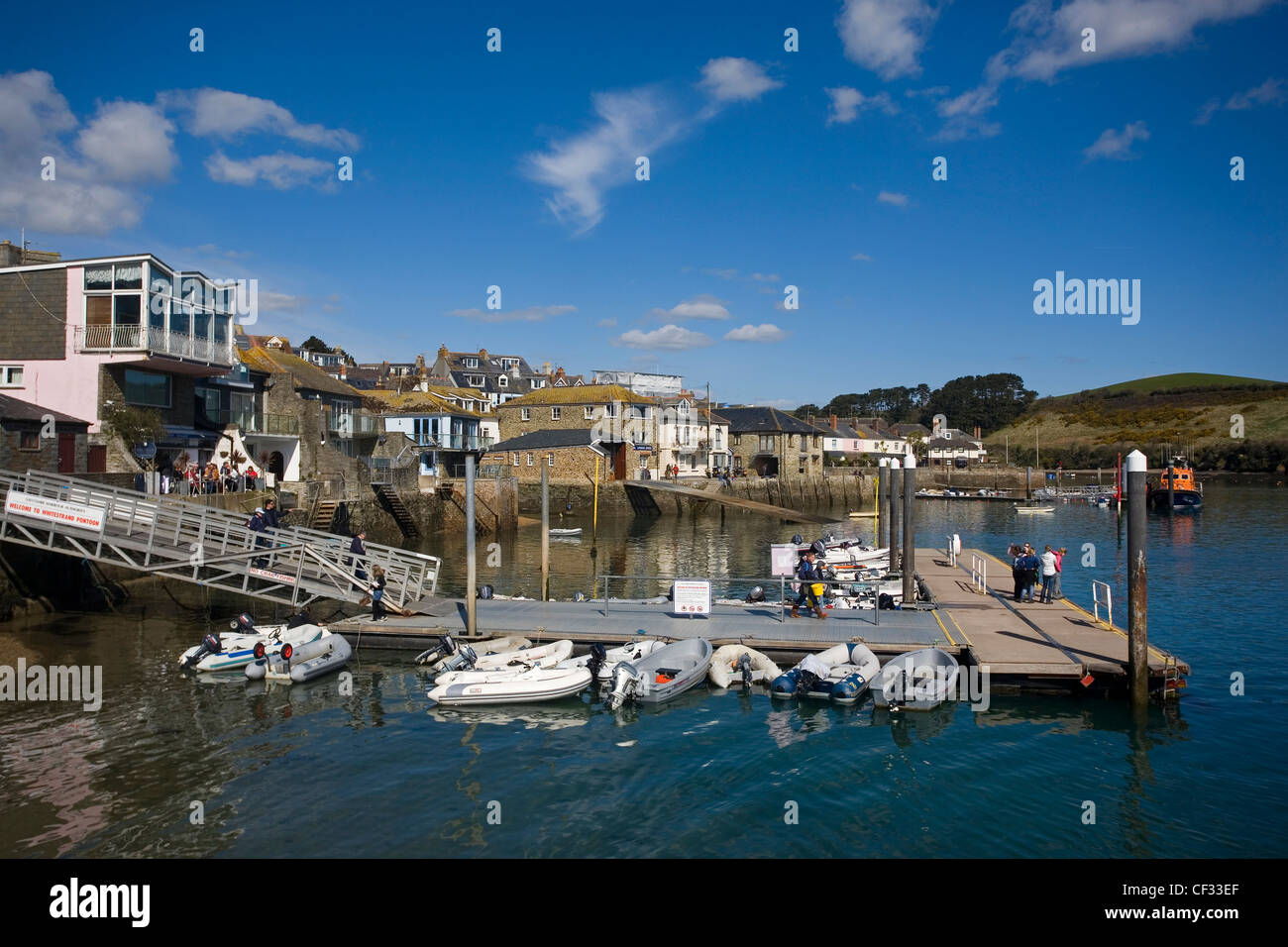 Small boats moored to Whitestrand Pontoon in Salcombe Harbour in Devon's most southerly town. Stock Photo