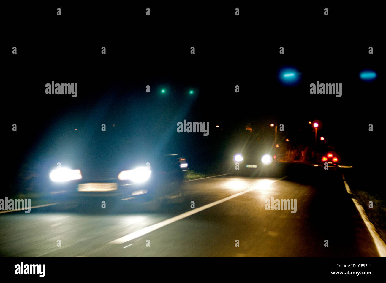 Blaring Headlights at night Stock Photo Alamy