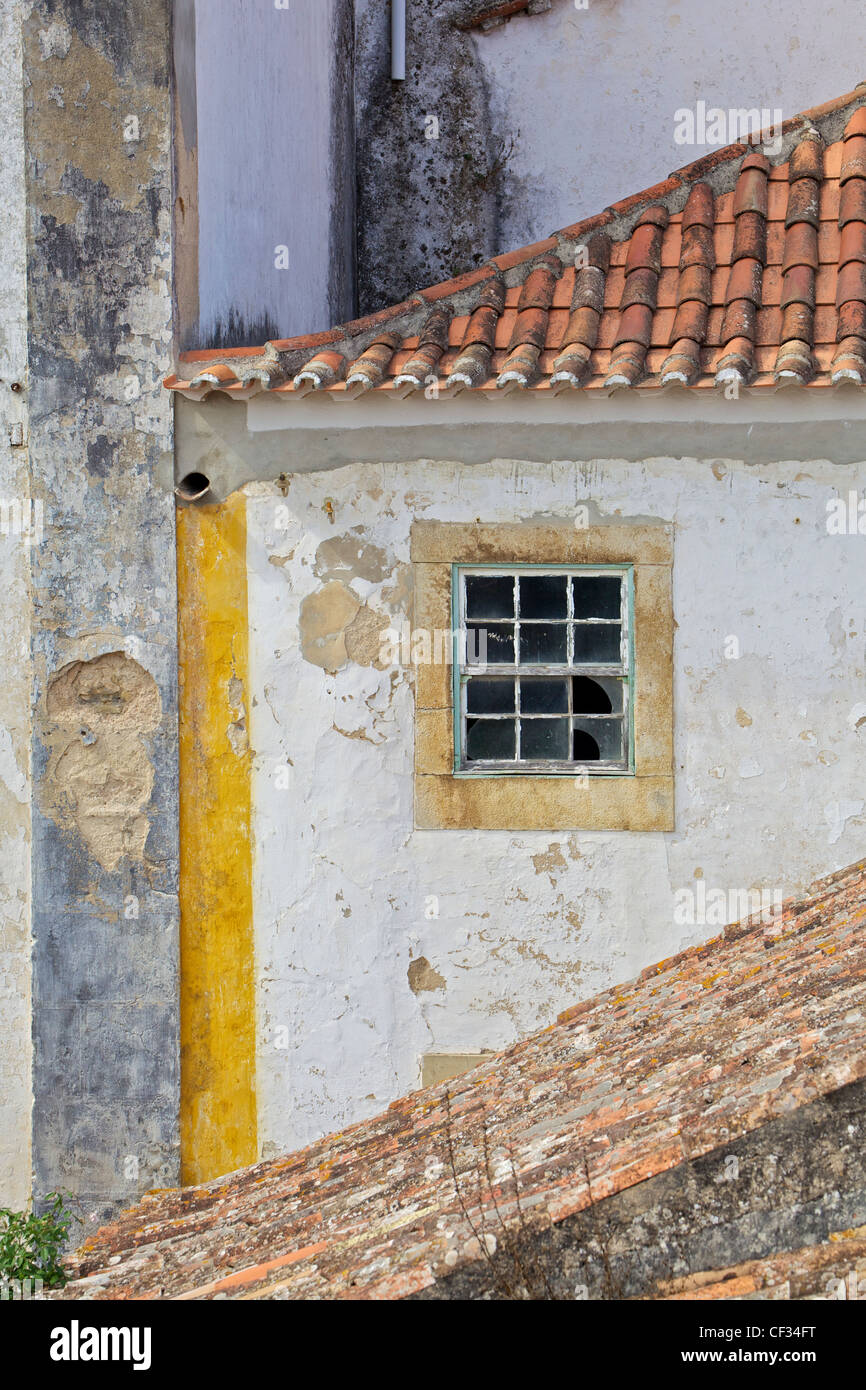 Broken Window in the Medieval Village of Obidos Stock Photo
