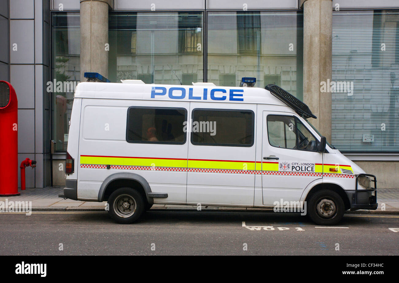 A City of London Police van parked at the side of a street. Stock Photo