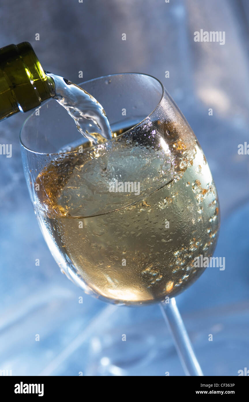 Bottle pouring wine into glass Stock Photo Alamy