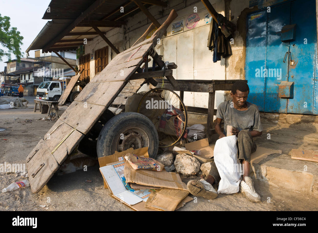 Homeless person and his bivouac Stone Town Zanzibar Tanzania Stock Photo
