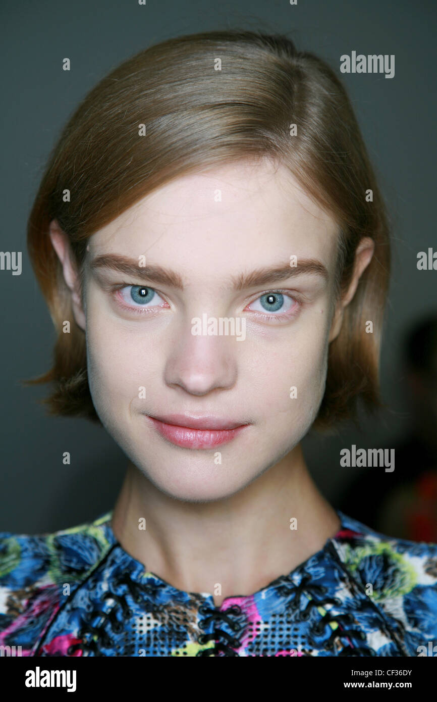 Balenciaga Paris Backstage Spring Summer Model with dark blonde hair in bob  wearing bright top with brown pencilled in eyebrows Stock Photo - Alamy