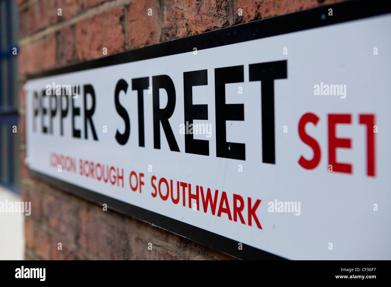 A view of a road sign for Pepper Street in the London Borough of Southwark Stock Photo