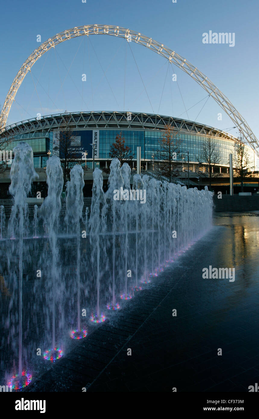 Fountain display and the new iconic Wembley Stadium in London Stock Photo Alamy