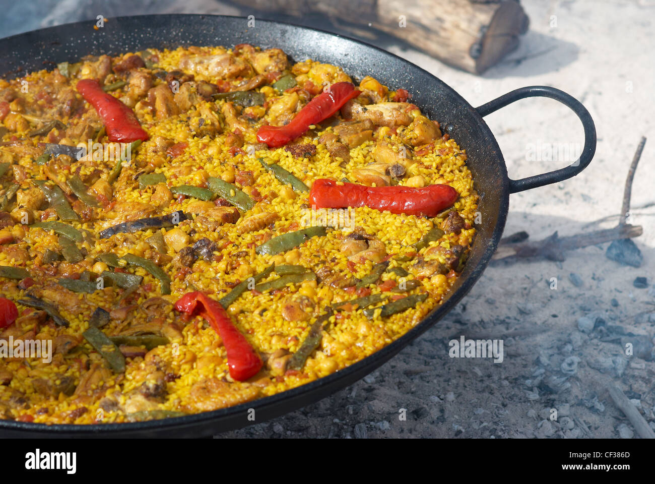 Traditional outdoor cooking of paella on open fire Stock Photo Alamy